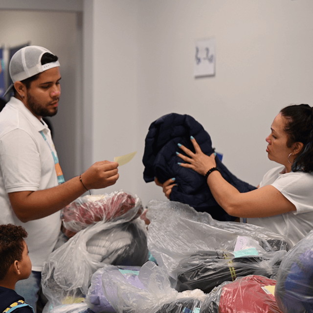 Volunteers organizing winter coats for distribution at VIA’s Annual Winter Coat Drive.